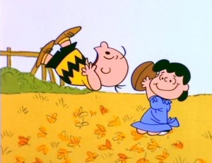 Lucy moving the football from Charlie Brown